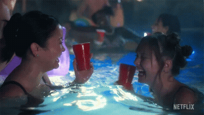 Girls Laughing In Pool With Netflix Logo GIF