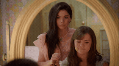 Girls Looking In Mirror And Brushing Hair GIF