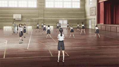 Girls Playing Volleyball In Red Curtain Gym GIF