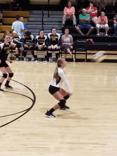 Girls Playing Volleyball With One Wearing A Jersey That Says 35 GIF