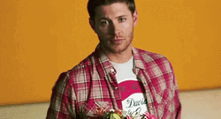 Giving Flowers Serious Man GIF