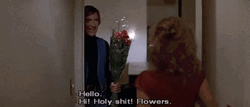 Giving Flowers To Young Woman GIF