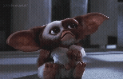 Gizmo From Gremlins Sitting Down GIF