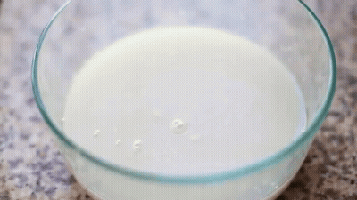 Glass Bowl Filled With White Liquid GIF
