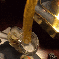 Glass Of Liquid Being Poured Into Another Glass GIF