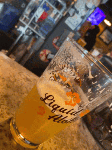 Glass Of Liquid Flow On Counter GIF