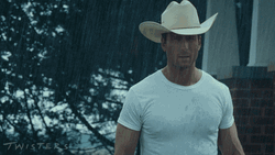 Glen Powell Walking Under The Rain GIF