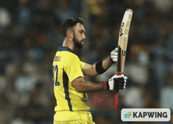 Glenn Maxwell Inspects Cricket Bat GIF