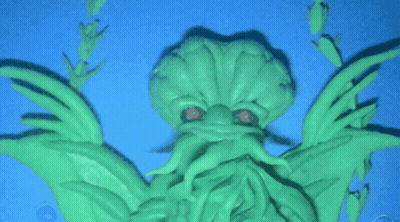 Glow In The Dark Green Monster Statue GIF