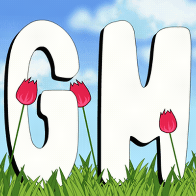 GM Letters Sitting In Grass With Red Flowers GIF