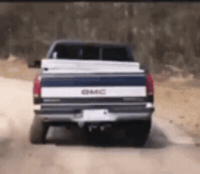GMC Truck Driving On Dirt Road GIF