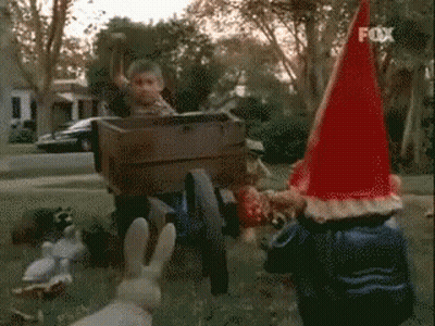 Gnome In Red Hat Laughing And Covering Mouth GIF