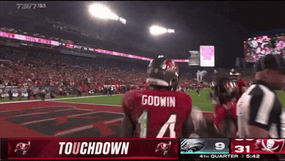 Godwin Football Player On Field During Touchdown GIF