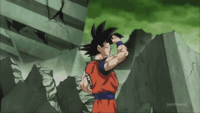 Goku From Dragon Ball Z Is Standing In Front Of A Concrete Wall . GIF