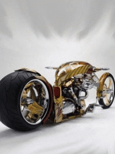 Gold And Silver Motorcycle With Large Tire GIF