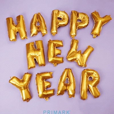 Gold Foil Balloons Spell Out Happy New Year GIF