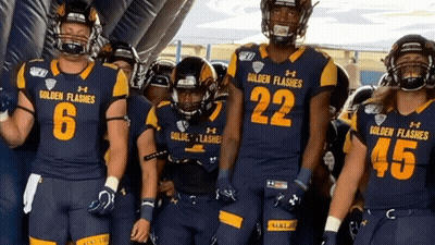 Golden Flashes Football Players Lined Up In Tunnel GIF
