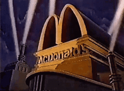 Golden McDonald's Sign Lit Up In Dark GIF