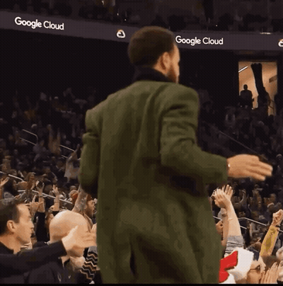 Golden State Warriors Basketball Player Stephen Curry Stands In Front Of A Logo For The Golden State Warriors GIF