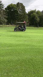 Golf Cart Moves With Man Hanging On GIF
