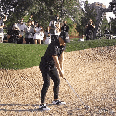 Golfer Hitting Golf Ball In Titleist Hat GIF
