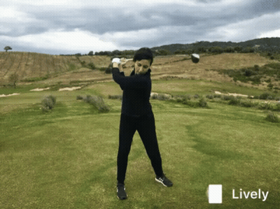 Golfer Swinging Club On Golf Course GIF