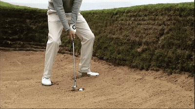 Golfer With C On Glove Hitting Ball GIF