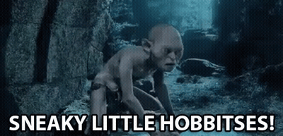 Gollum From The Lord Of The Rings Is Crawling On The Ground In A Cave And Saying `` Sneaky Little Hobbitses ! '' GIF
