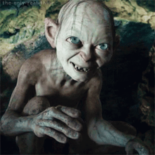 Gollum From The Lord Of The Rings Is Looking At The Camera GIF