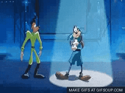 Goofy And Mickey Mouse Are Dancing Together On A Stage . GIF