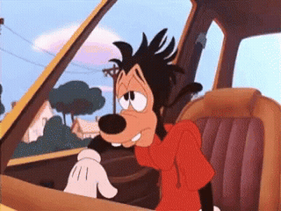 Personaje caricaturesco Goofy sentado en un coche GIF