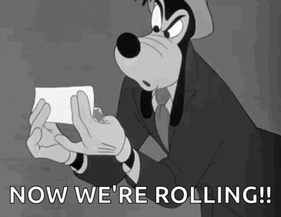 Goofy Holding Paper Saying Now We're Rolling GIF