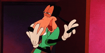 Goofy Is A Cartoon Character From Mickey Mouse Making A Funny Face And Giving The Middle Finger . GIF
