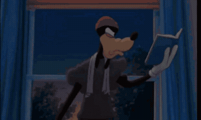 Goofy Is Reading A Book In Front Of A Window While Wearing A Towel Around His Neck . GIF