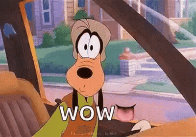 Goofy Is Sitting In The Driver 'S Seat Of A Car . GIF