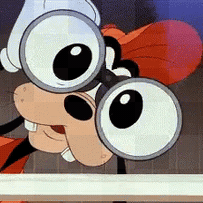 Goofy Looking Over Fence With Binoculars GIF