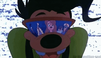 Goofy Wearing Goggles With Mickey Mouse Behind Him GIF