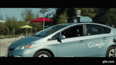 Google Car Driving Down Street With Umbrellas GIF