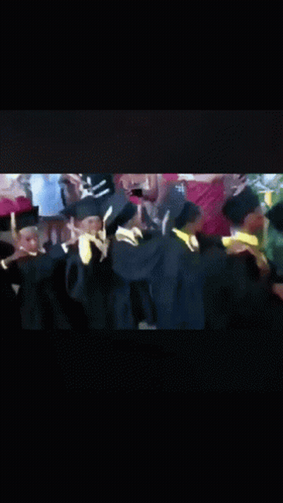 Graduates Dancing In Caps And Gowns GIF