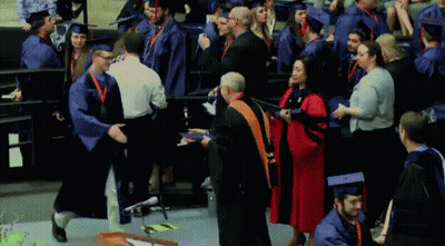 Graduates In Caps And Gowns GIF
