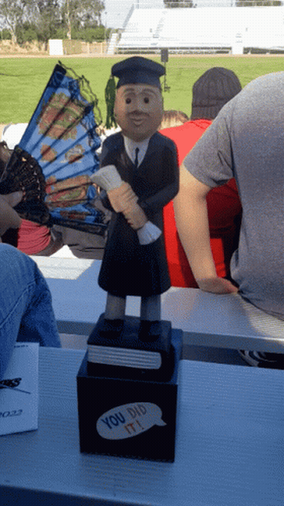 Graduation Statue Holding Diploma GIF