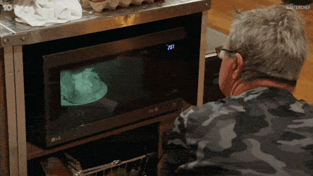 Grandma Waiting Food In Microwave Oven GIF