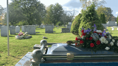 Grave With Flowers And Name Starting With A GIF
