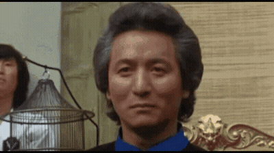 Gray Haired Man In Blue Shirt With Bird Cage GIF