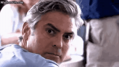 Gray-Haired Man Looking Over Shoulder On Plane GIF