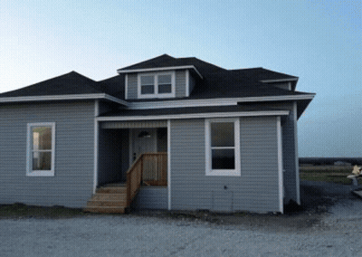 Gray House With Black Roof And Stairs GIF
