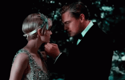 Great Gatsby Jay Holding Daisys Face GIF