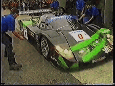 Green And Black Race Car With Number 0 GIF