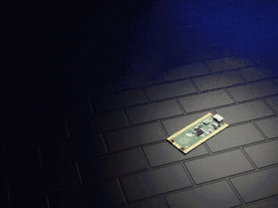 Green And Gold Motherboard On Black Brick Floor GIF