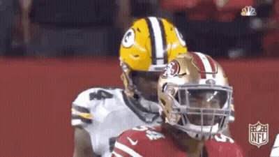 Green Bay Packers And San Francisco 49Ers Football Players Standing On Field GIF